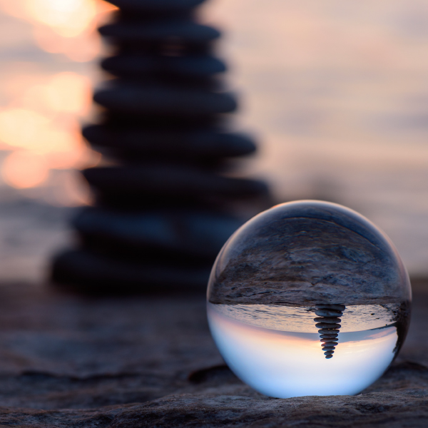 Sphere showing inverted image of a beach