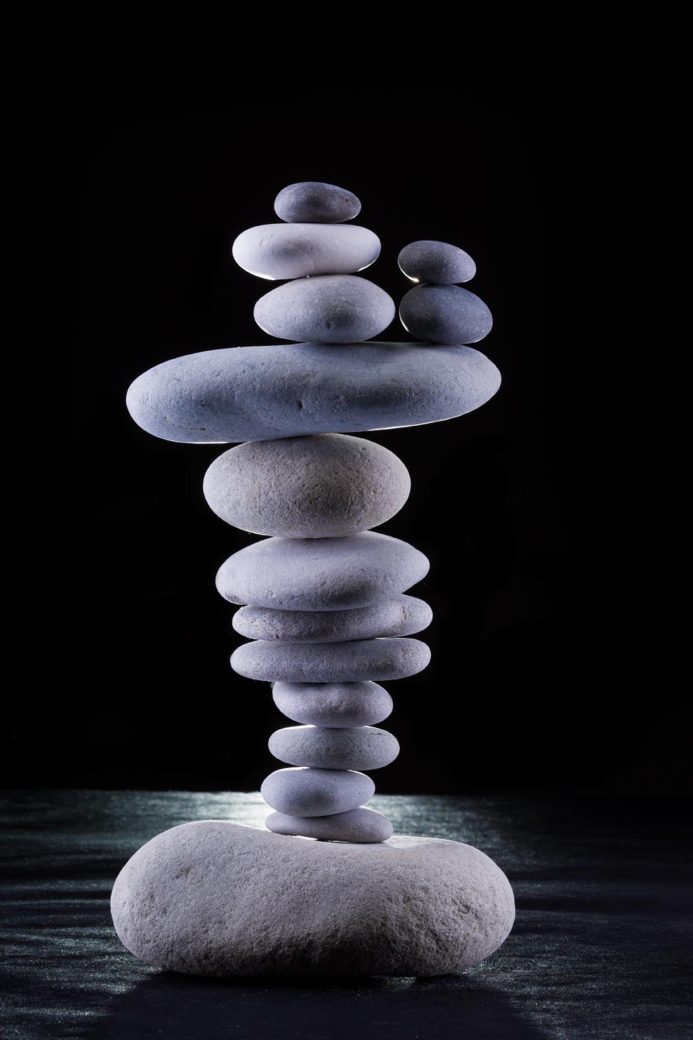 Different sized rocks stacked in balance